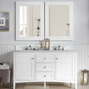 A modern bathroom features the Palisades 60 inch Double Bathroom Vanity in Bright White, with a sleek marble countertop and silver fixtures. Two large mirrors and a small lantern adorn the space, while light gray walls, elegant wainscoting, and a cozy stool add charm.