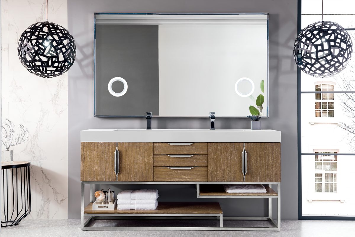 A modern bathroom features the Columbia 72 Latte Oak double-sink vanity with brushed nickel, complete with drawers and shelves, topped by a large mirror. Two black spherical pendant lights elegantly hang from the ceiling, while a window to the right bathes the space in natural light.