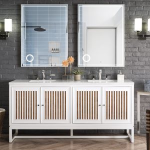 A modern bathroom features the Athens 72 Double Bathroom Vanity in Glossy White, enhanced by striped wood cabinet doors and topped with two square mirrors. The dark textured wall has two wall sconces, with natural light streaming from a right-side window. A towel hangs conveniently beside the sink.