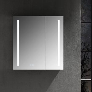 The Pillar 30 Inch LED Lighted Medicine Cabinet, featuring vertical LED strips, stands wall-mounted as a modern mirror. Its positioned against a dark wall near a window showcasing a starry night sky with tree silhouettes.