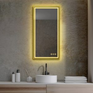 A modern bathroom showcases the Stellar 18 Inch LED Light Bathroom Mirror glowing above a textured wall. Below it is a sleek white sink with a black faucet, and the wooden countertop neatly holds bath accessories and folded towels.