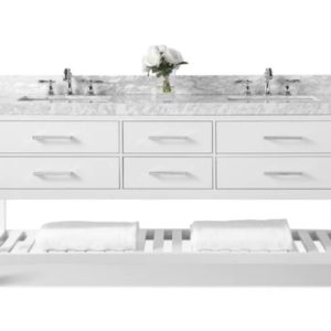 The Elizabeth 72 in. Bath Vanity Set in White showcases a double-sink design with a marble countertop and two faucets. Below are six drawers with silver handles, while a lower shelf holds towels. A vase with white flowers is elegantly centered on the counter.