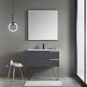 A modern bathroom features the Sofia 36 inch Wall Mount Bathroom Vanity in Matte Gray with a square mirror above its surface and dual spacious drawers. A round hanging light elegantly complements the minimalist design, while a small side table discreetly holds toiletries for convenience.