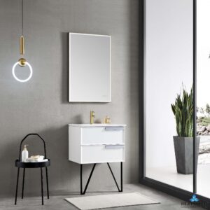 A minimalist bathroom features the Sofia 24 inch Wall Mount Bathroom Vanity With Sink - Matte White, accentuated by a gold faucet and round mirror. A modern pendant light illuminates a black side table with a candle and towel, while scenic views and greenery from a potted plant can be seen through a large window.