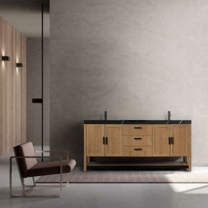 A minimalist bathroom features a Winchester 72 Pecan Oak Freestanding Vanity with a black countertop and dual sinks against a light gray wall. A modern brown chair sits on a rug beside the vanity, enhanced by vertical wooden paneling on the left.