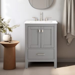 The small bathroom scene features a Vanea 24 inch Bathroom Vanity in Gray with a white quartz top and silver faucet. A mirror sits above it. To the left is a wooden side table with a plant, and on the right, a light towel enhances the neutral walls for minimalist elegance.