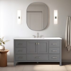 A modern bathroom highlights the Vanea 60 Single Vanity in gray with a white quartz top, featuring multiple drawers and a silver faucet. An oval mirror hangs above, flanked by vertical lights. A towel is on the right hook, and a plant sits on a wooden stool.