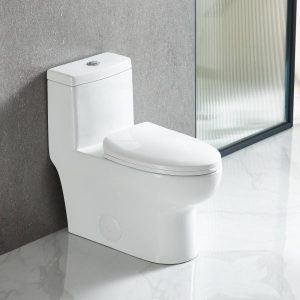 The Pureflow One Piece Toilet with a closed lid is installed on a glossy marble floor beside a gray wall and a frosted glass partition.
