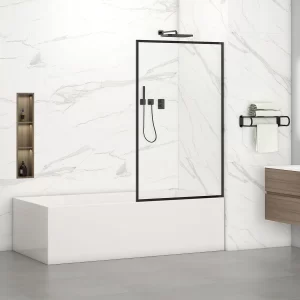 A modern bathroom featuring a Neil 34W x 62H Bathtub Screen Door with a black-framed glass panel, white marble design, and built-in shelving with toiletries. A handheld showerhead is installed above. To the right is a wooden vanity with towel rack, set atop elegant gray floor tiles.