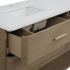 The Lucian 72 inch Double Bathroom Vanity adds a modern flair with its textured horizontal wood grain and sleek gold handles. A white countertop featuring a sink tops the vanity, and one drawer opens to display neatly organized storage compartments.