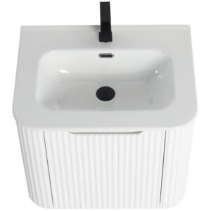 The Caskvalley 24 Inch Wall Mounted Bathroom Vanity features a ribbed cabinet with a white rectangular basin, a sleek black faucet, central drain, and overflow hole, offering a modern design that contrasts beautifully with the smooth sink surface.