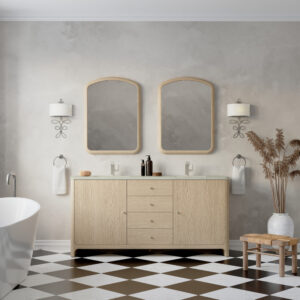 A modern bathroom features the Gracyn 72 inch Double Bathroom Vanity in Coastal Driftwood, two mirrors, and wall sconces. A freestanding bathtub is on the left, with tall dried plants in a vase and two wooden stools enhancing the checkered floor on the right.