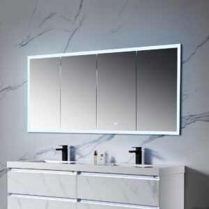 A contemporary bathroom features a double sink vanity with sleek fixtures against a gray marbled wall. Above the sinks, the Capella 72 inch LED Medicine Cabinet shines, offering a backlit four-panel mirror. A small bottle and soap dispenser are neatly arranged on the countertop.