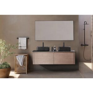 Modern bathroom featuring the Ocala 60 Inch Wall Mount Bathroom Vanity With Vessel Sink, double sinks, large mirror, black faucets, towel shelf with folded towels, a potted plant, minimalist neutral decor, and a black shower fixture in the background.