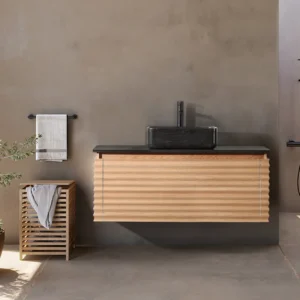 Minimalist bathroom with the Ocala 48 Inch Wall Mount Bathroom Vanity With Vessel Sink, a black sink, towel rack, potted plant, slatted laundry basket, and an open rain shower area in the background.