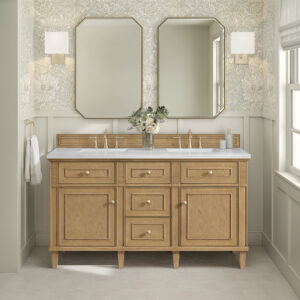 A bathroom featuring the Lorelai 60 inch Double Bathroom Vanity, two gold-framed mirrors, wall sconces, floral wallpaper, a flower vase, a window with white blinds, and a towel hanging on the left wall.