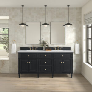 A modern bathroom features the Lorelai 72 inch Double Bathroom Vanity with brass hardware, two rectangular mirrors, pendant lights, white tile walls, light wood floors, and towel rings. Sunlight streams in from a large window.