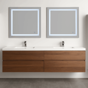 A modern bathroom with a double sink vanity featuring wooden drawers and two rectangular, illuminated mirrors above each sink; the floor is tiled in gray.