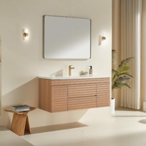 Modern bathroom with Linea 48 Inch Wall Mounted Bathroom Vanity, square mirror, gold faucet, wall sconces, wooden stool with books, potted plant by sheer-curtained window, all in a neutral color palette.