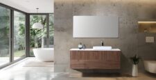 A modern bathroom showcases an Orsa 60 Inch Wall Mount Bathroom Vanity With Vessel Sink beneath a large mirror, with decorative accents. Expansive windows offer views of greenery and a freestanding tub, creating a bright, minimalist retreat.